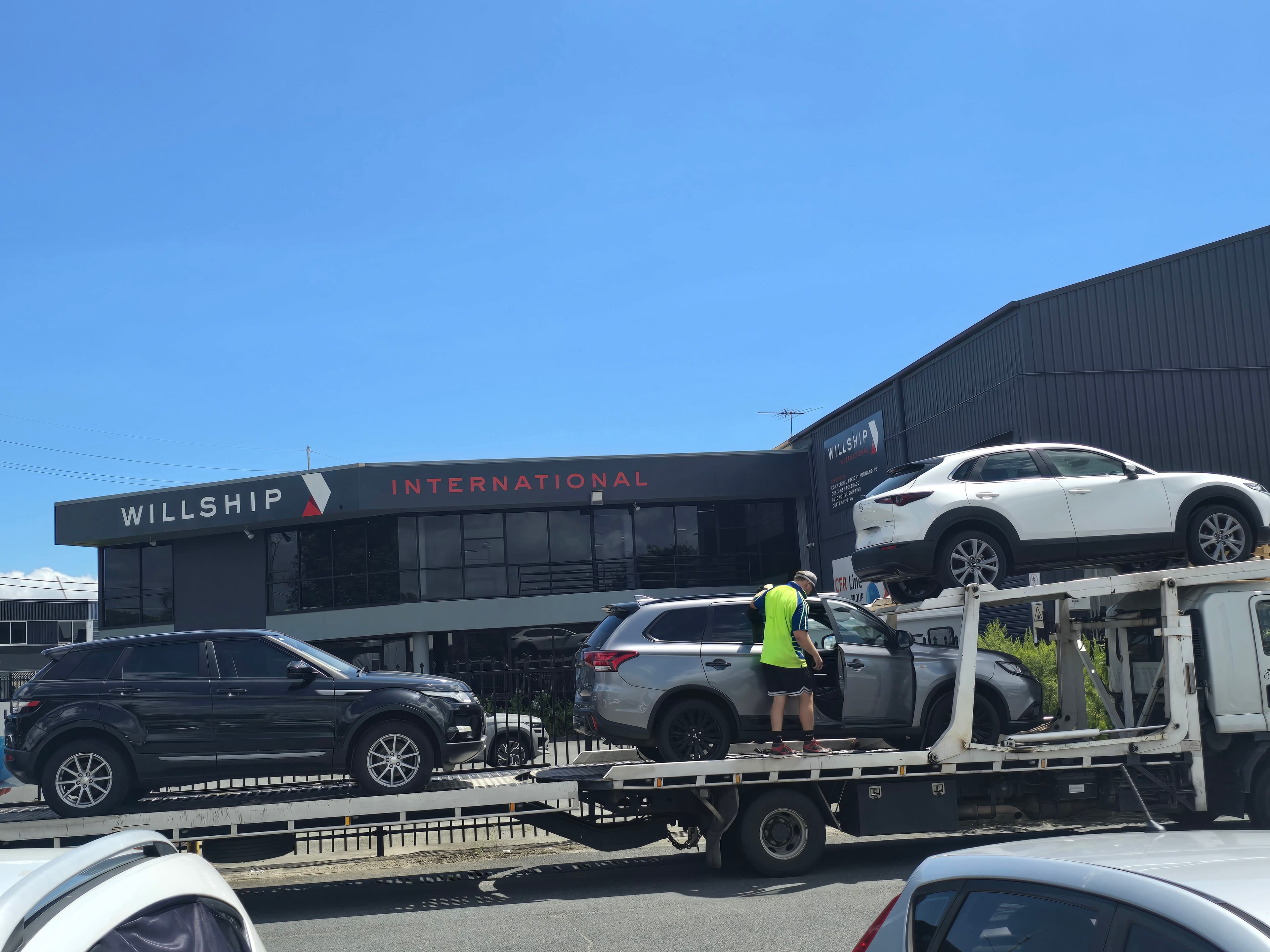 Vehicle parked near shipping containers