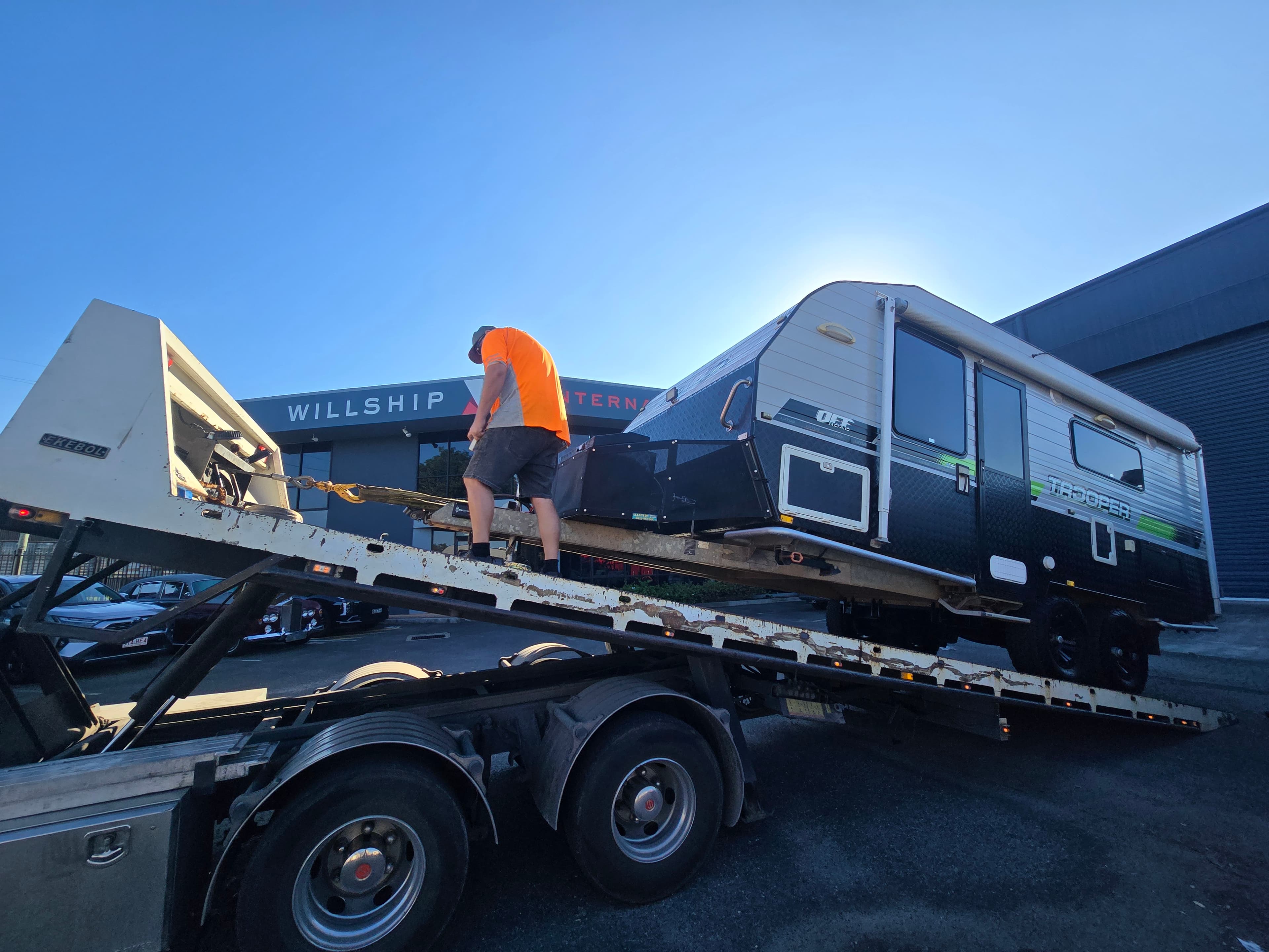 Vehicle parked near shipping containers